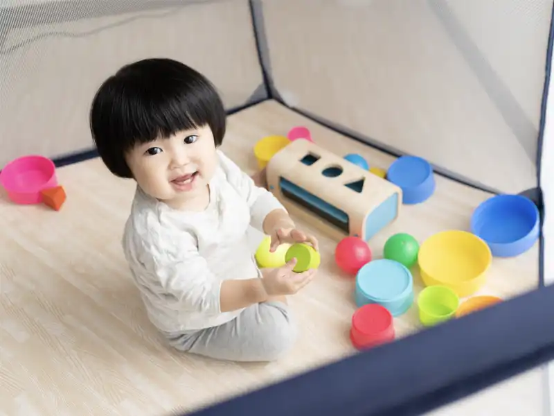 VALE-VILLAGE-CHILDCARE-CENTRE-child-on-floor-playing