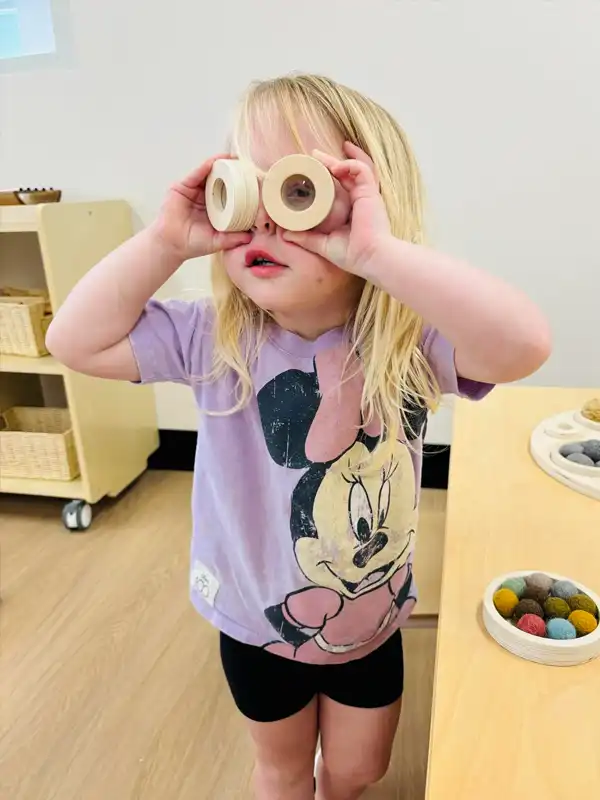 VILLAGE-VALE-CHILDCARE-CENTRE-girl-with-glasses-